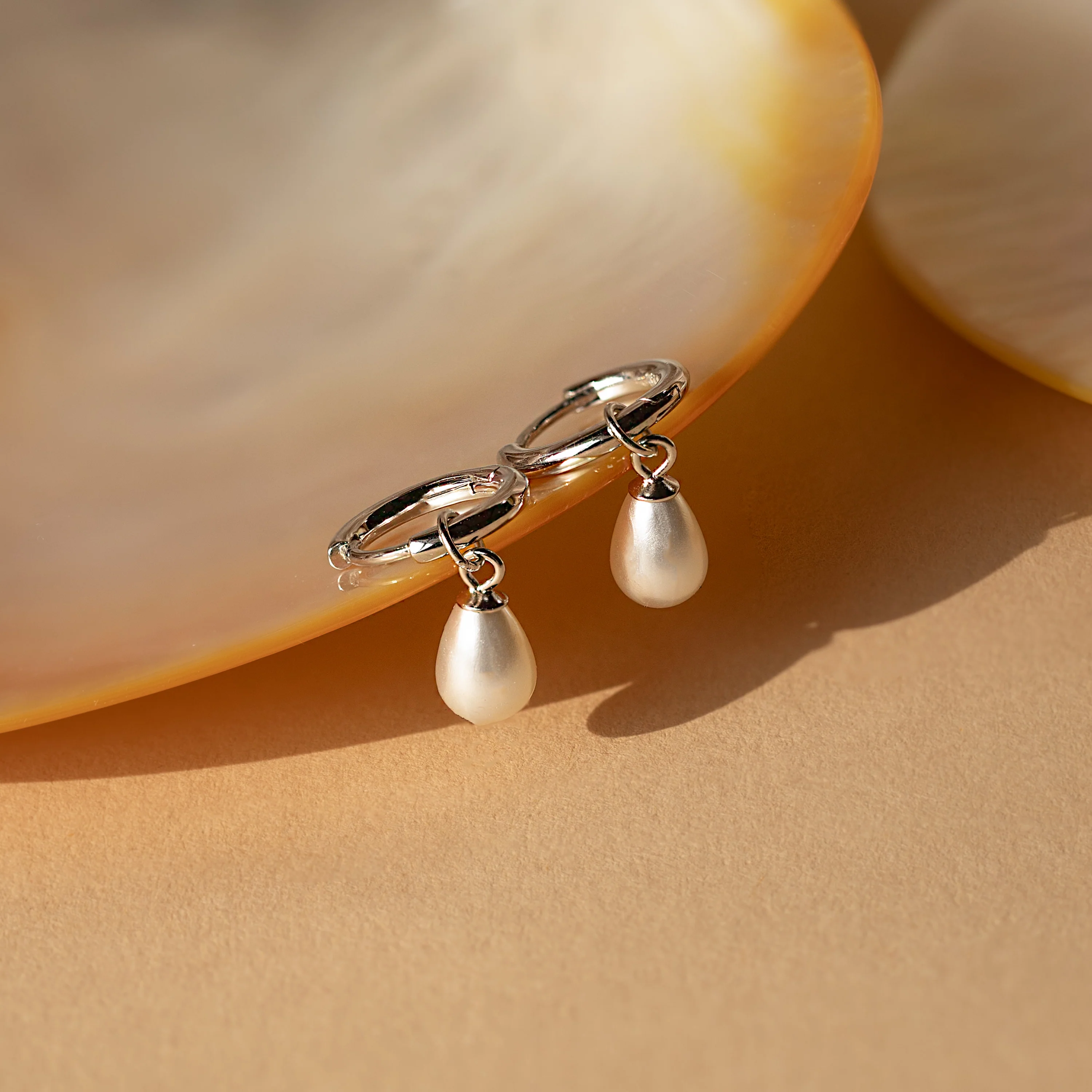 Dainty Pearl Drop Huggies in Silver - Image 2
