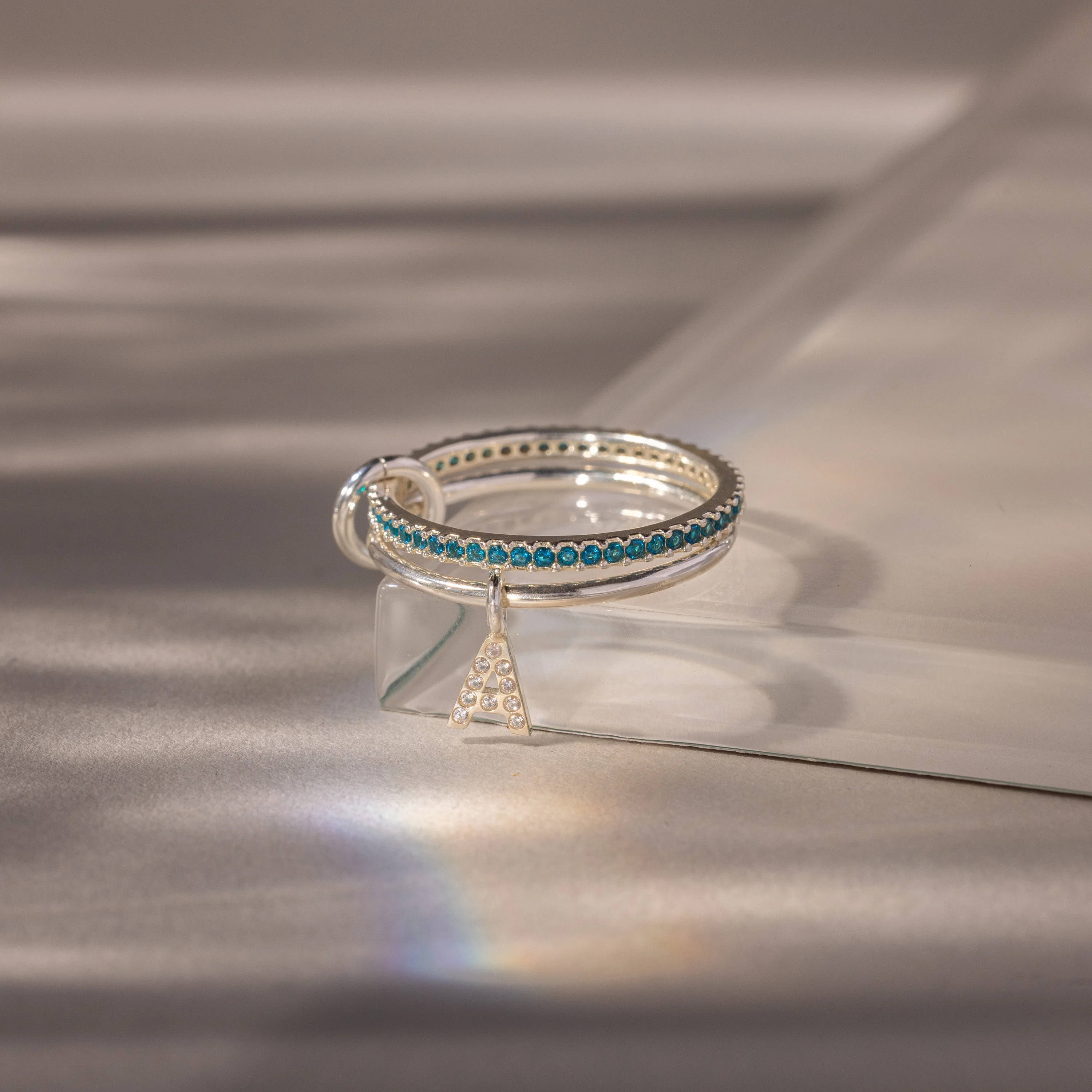 Linked Initial Blue Zircon Ring Set - Image 3