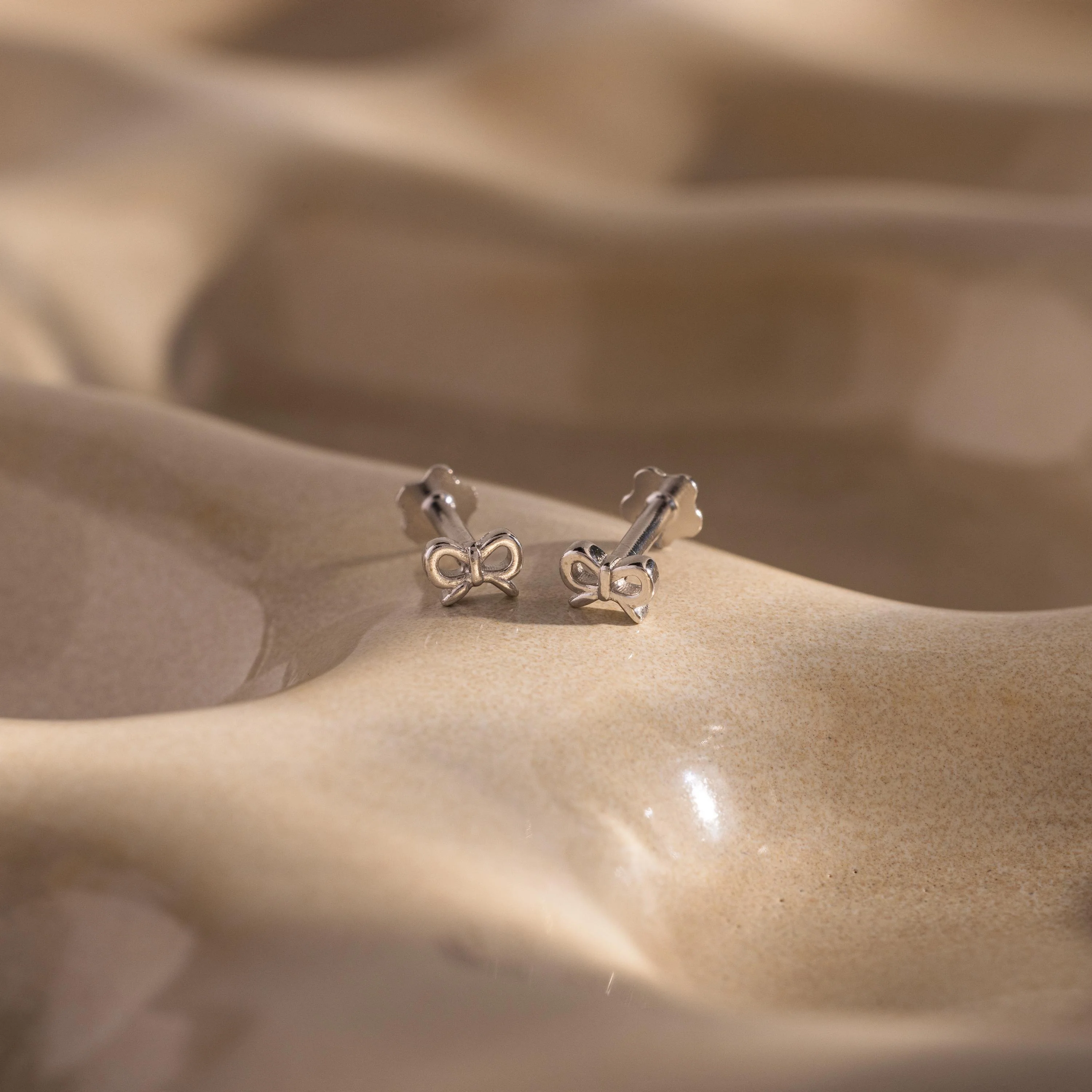 Tiny Bow Flatback Studs in Silver